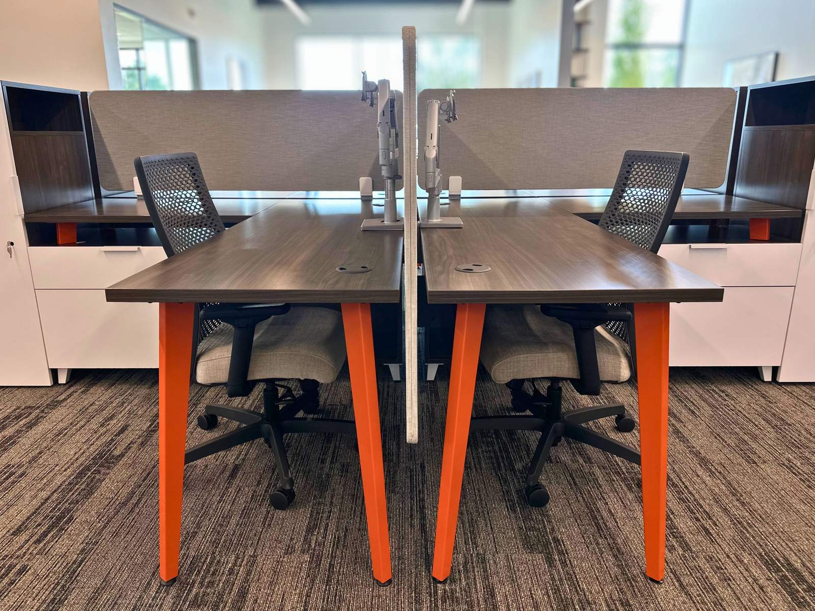 A pair of facing dedicated desks with task chairs at SpringPad in Lincoln, Nebraska